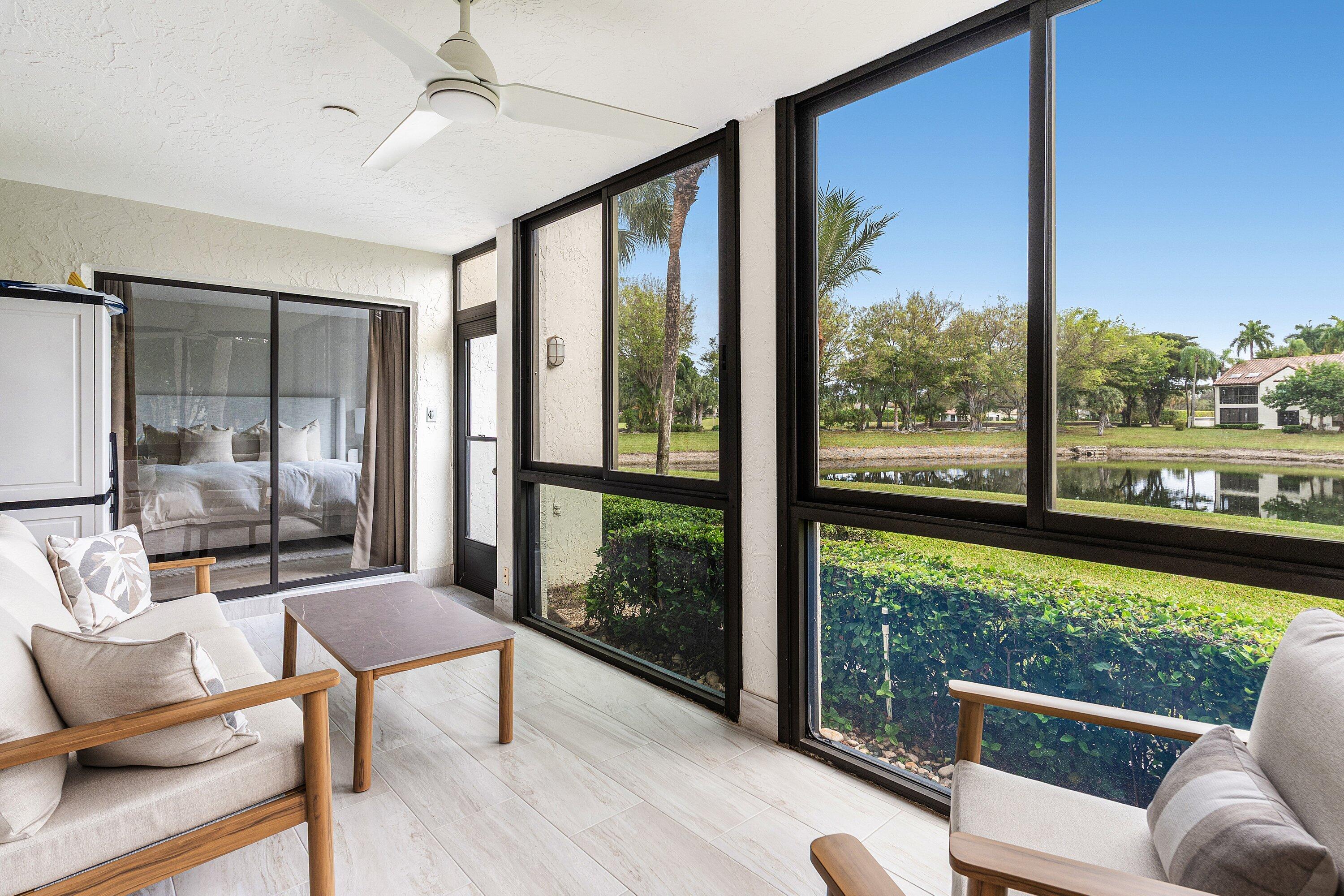 7918 Granada Place, Unit 103 Boca Raton, FL 33433 - Photo 22 of 31 a living room with large windows