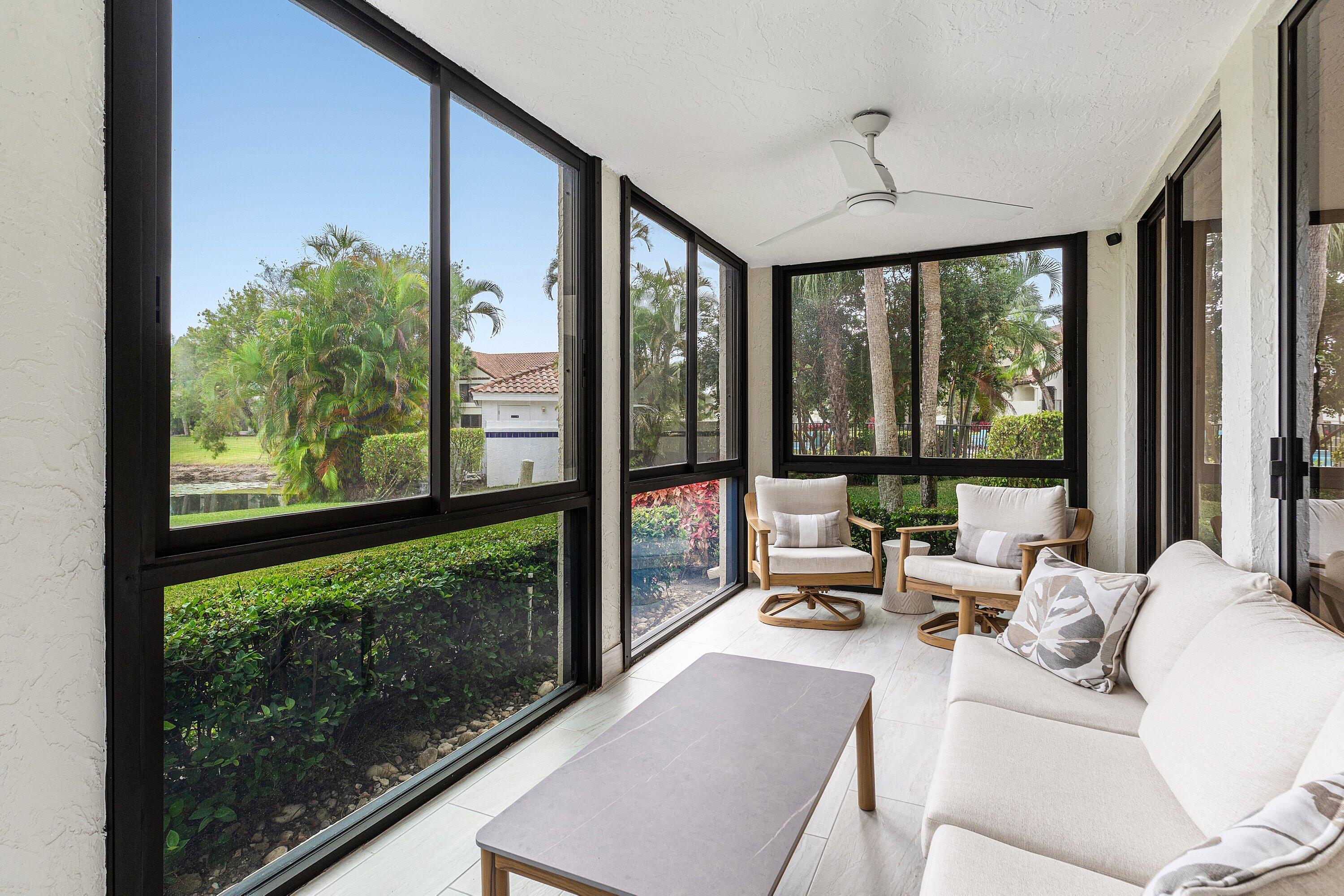 7918 Granada Place, Unit 103 Boca Raton, FL 33433 - Photo 23 of 31 a living room with large windows