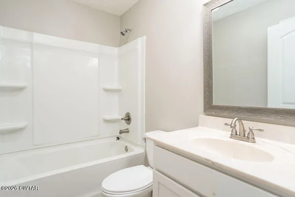 a bathroom with a sink toilet and a bathtub