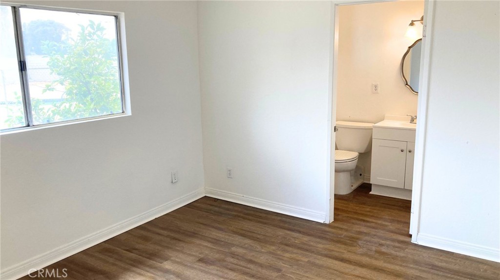 25141 Silent Creek Road Moreno Valley, CA 92553 - Photo 14 of 40 a bathroom with a toilet and a shower