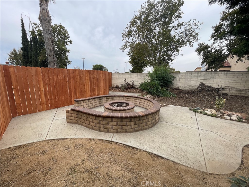 25141 Silent Creek Road Moreno Valley, CA 92553 - Photo 16 of 40 a view of a swimming pool with a yard