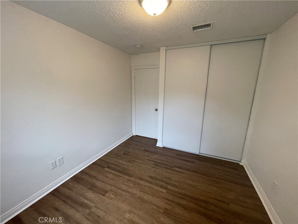 25141 Silent Creek Road Moreno Valley, CA 92553 - Photo 17 of 40 a view of room with wooden floor