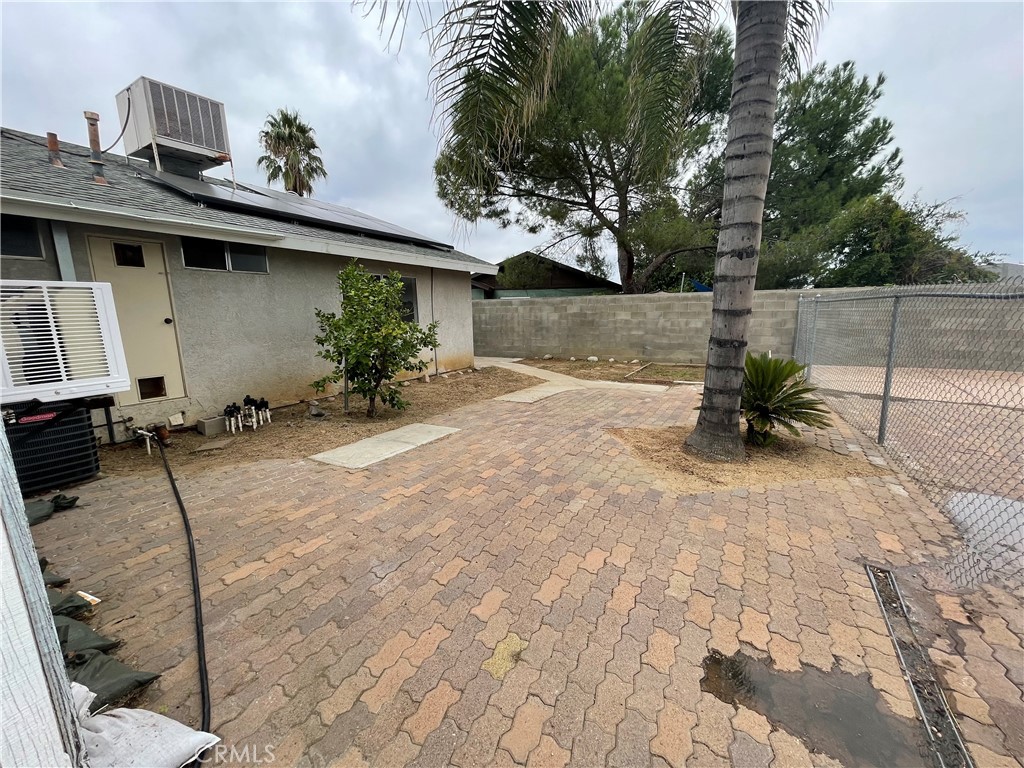 25141 Silent Creek Road Moreno Valley, CA 92553 - Photo 19 of 40 a view of a backyard with a chair and potted plants