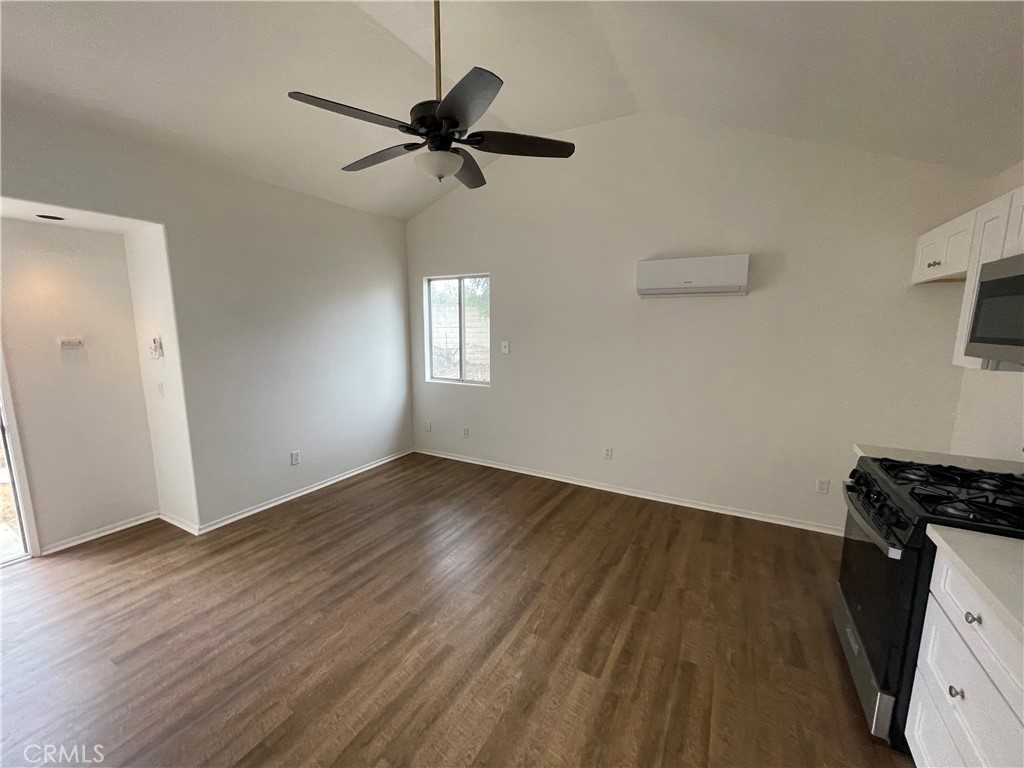 25141 Silent Creek Road Moreno Valley, CA 92553 - Photo 22 of 40 a view of an empty room with wooden floor and a window