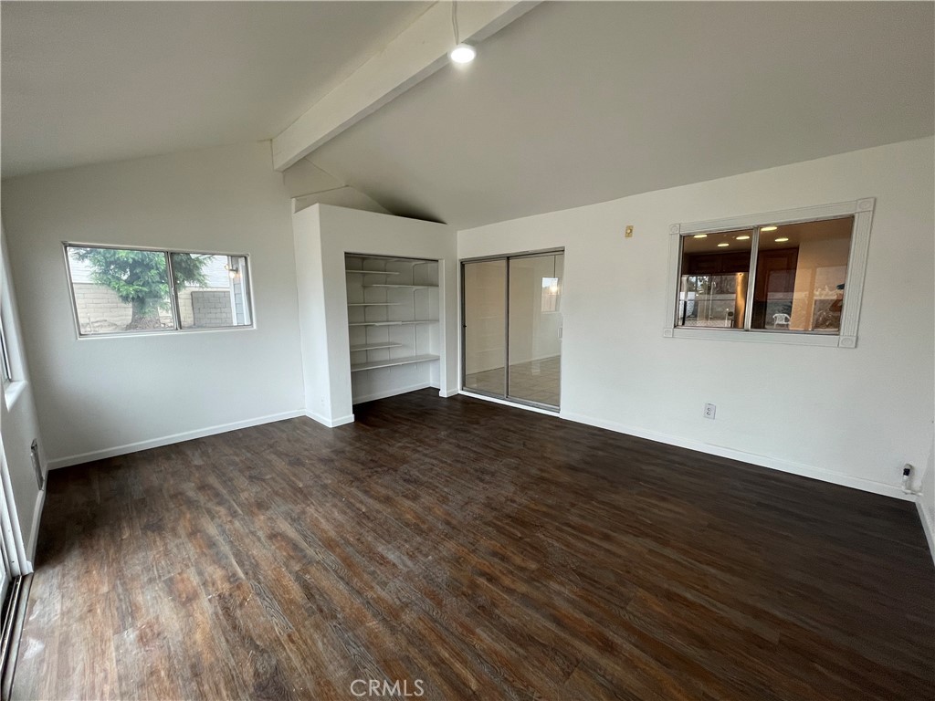 25141 Silent Creek Road Moreno Valley, CA 92553 - Photo 29 of 40 a view of a big room with wooden floor and windows