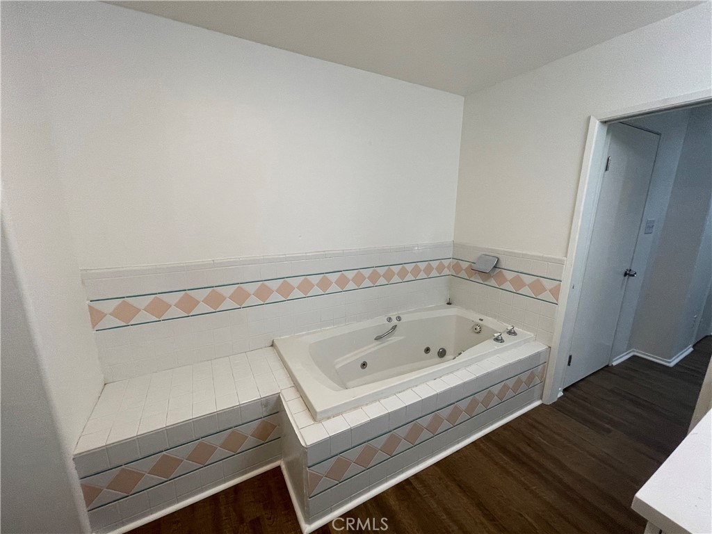 25141 Silent Creek Road Moreno Valley, CA 92553 - Photo 31 of 40 a bathroom with a tub and a sink