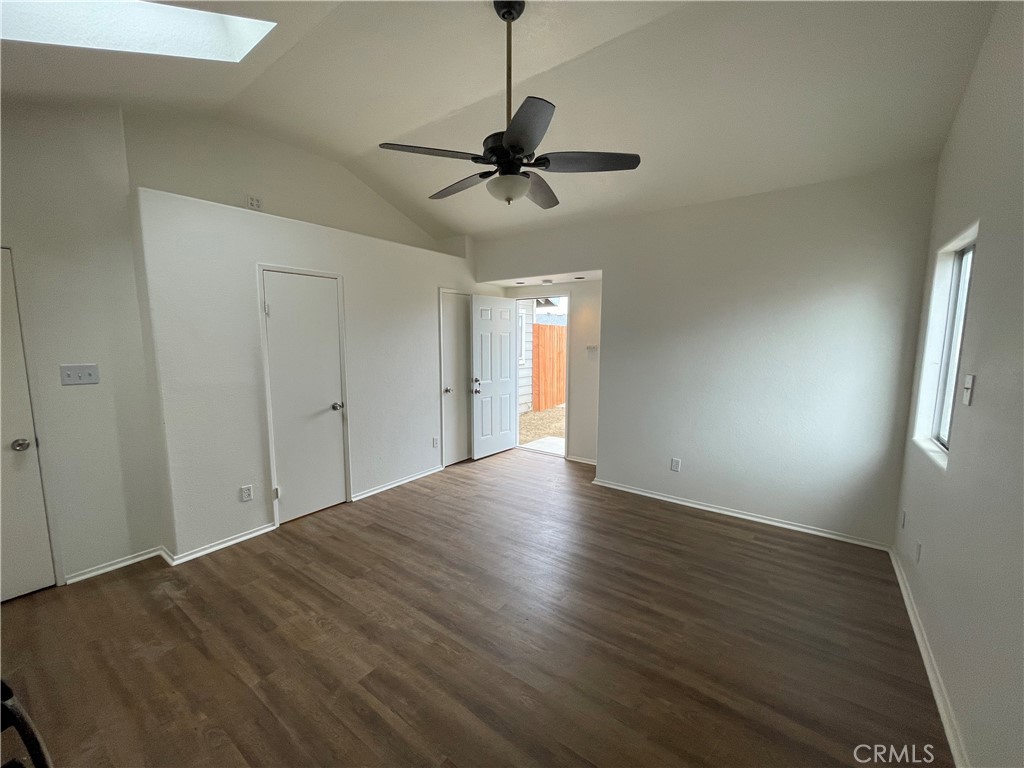 25141 Silent Creek Road Moreno Valley, CA 92553 - Photo 38 of 40 a view of a livingroom with a ceiling fan and hardwood floor