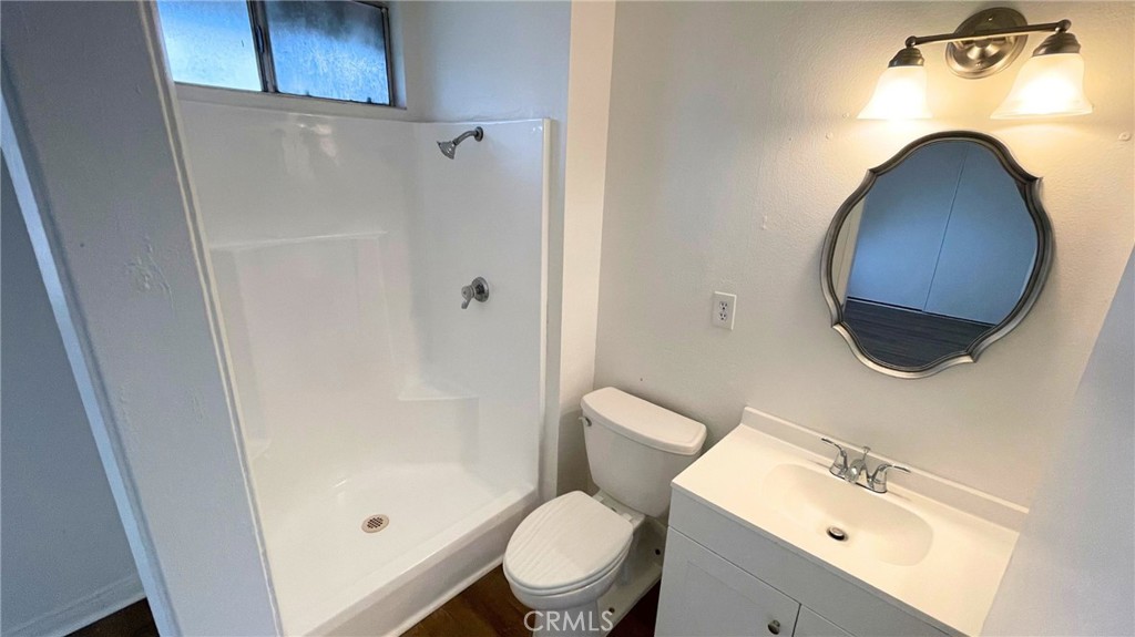 25141 Silent Creek Road Moreno Valley, CA 92553 - Photo 10 of 40 a bathroom with a toilet and a sink