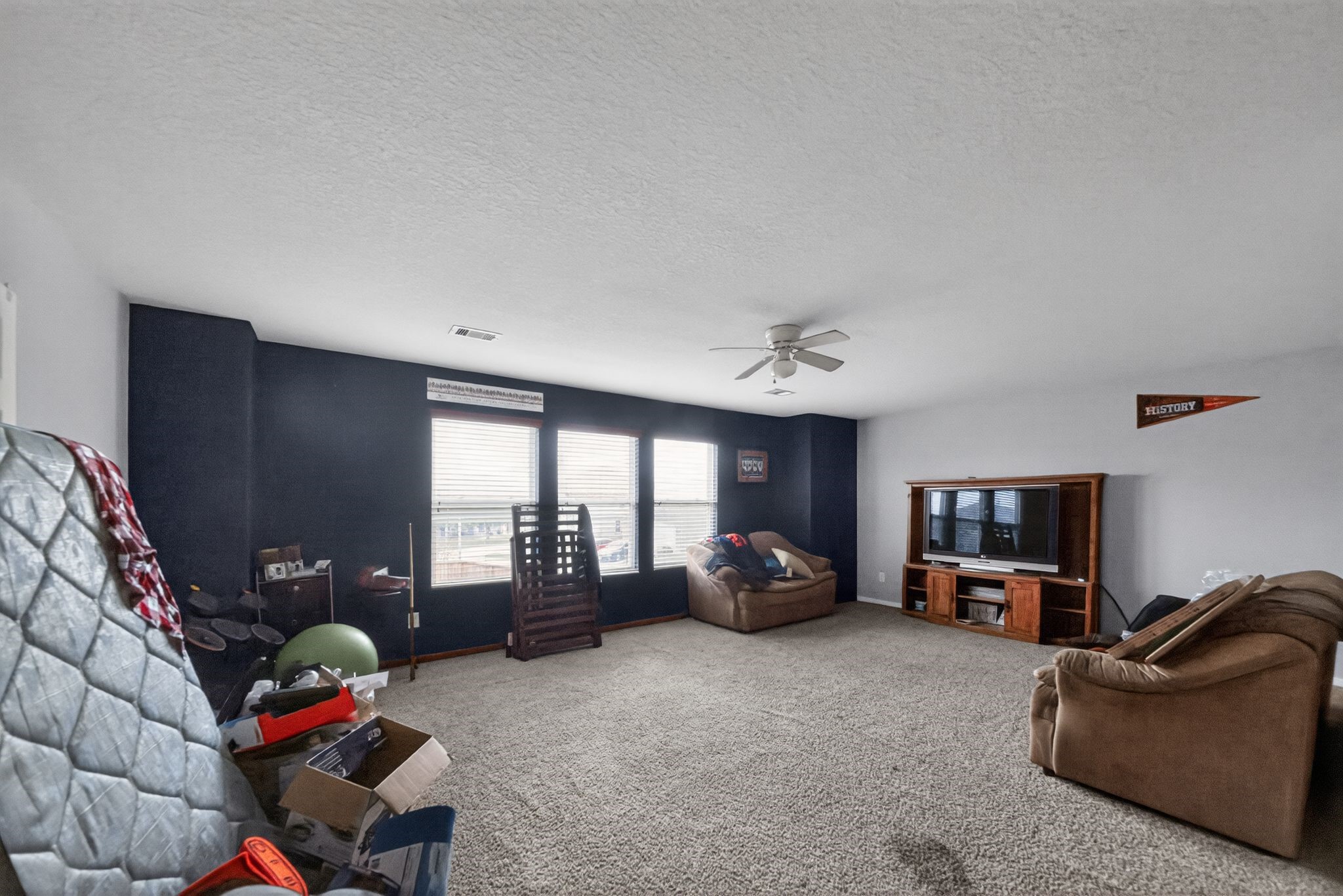7902 Sesame Street Baytown, TX 77521 - Photo 7 of 24 a living room with furniture and a flat screen tv