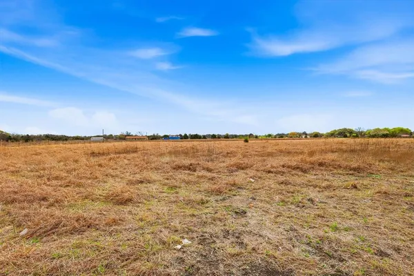 a view of a lake with a yard