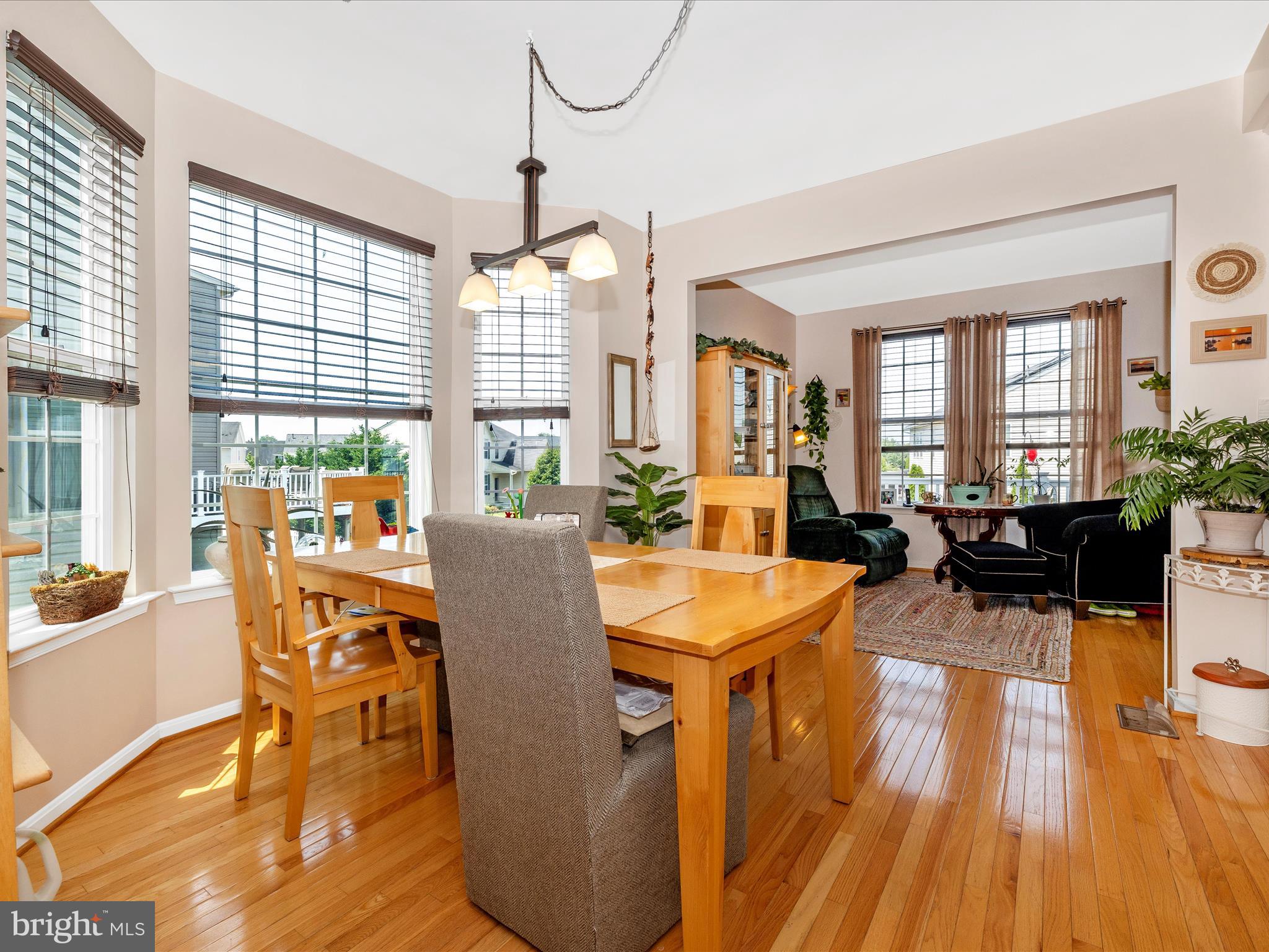 12954 Yellow Jacket Road Hagerstown, MD 21740 - Photo 13 of 54 a view of a dining room with furniture window and wooden floor