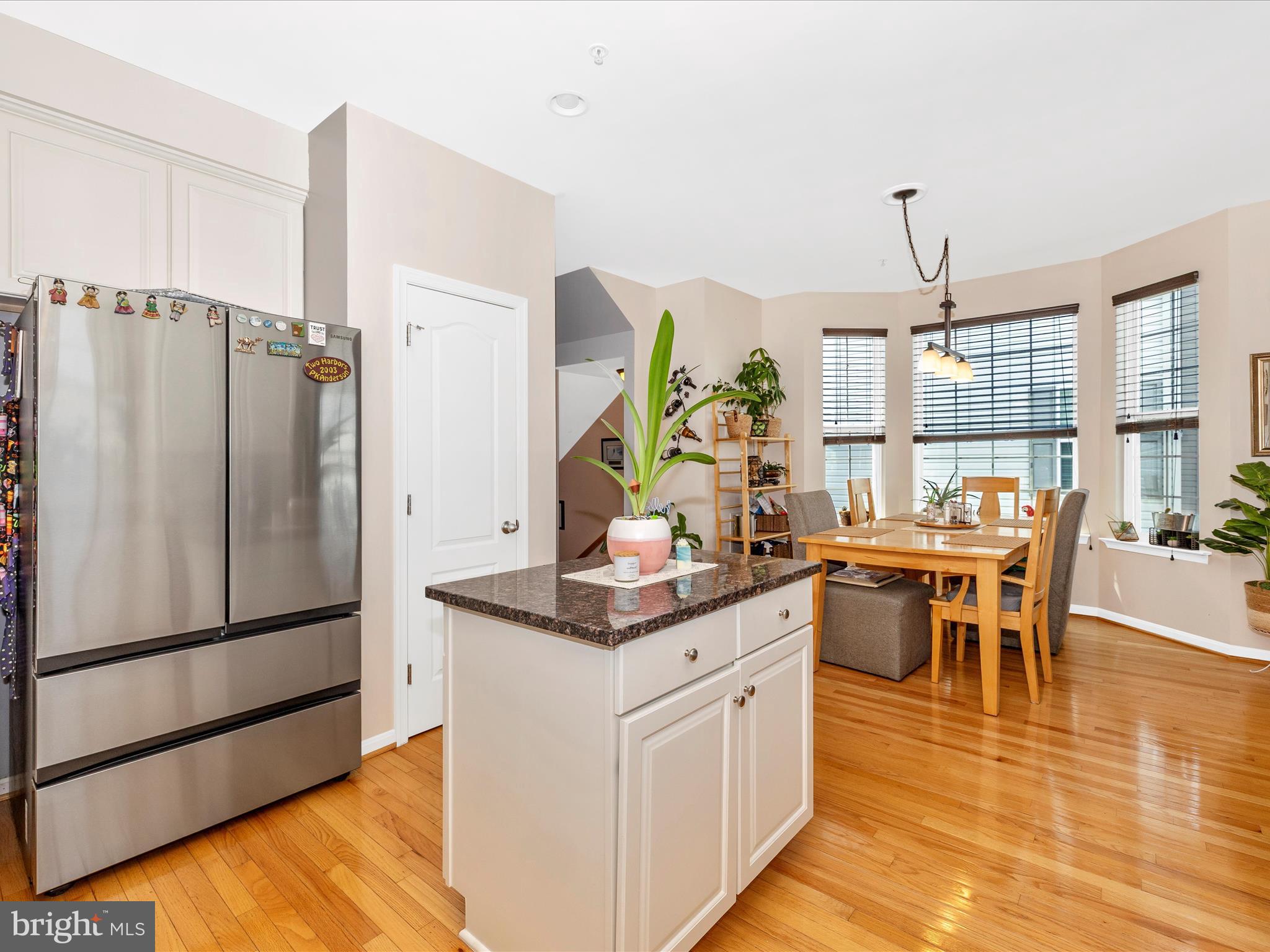 12954 Yellow Jacket Road Hagerstown, MD 21740 - Photo 17 of 54 a kitchen with stainless steel appliances granite countertop a refrigerator a stove a dining table and chairs