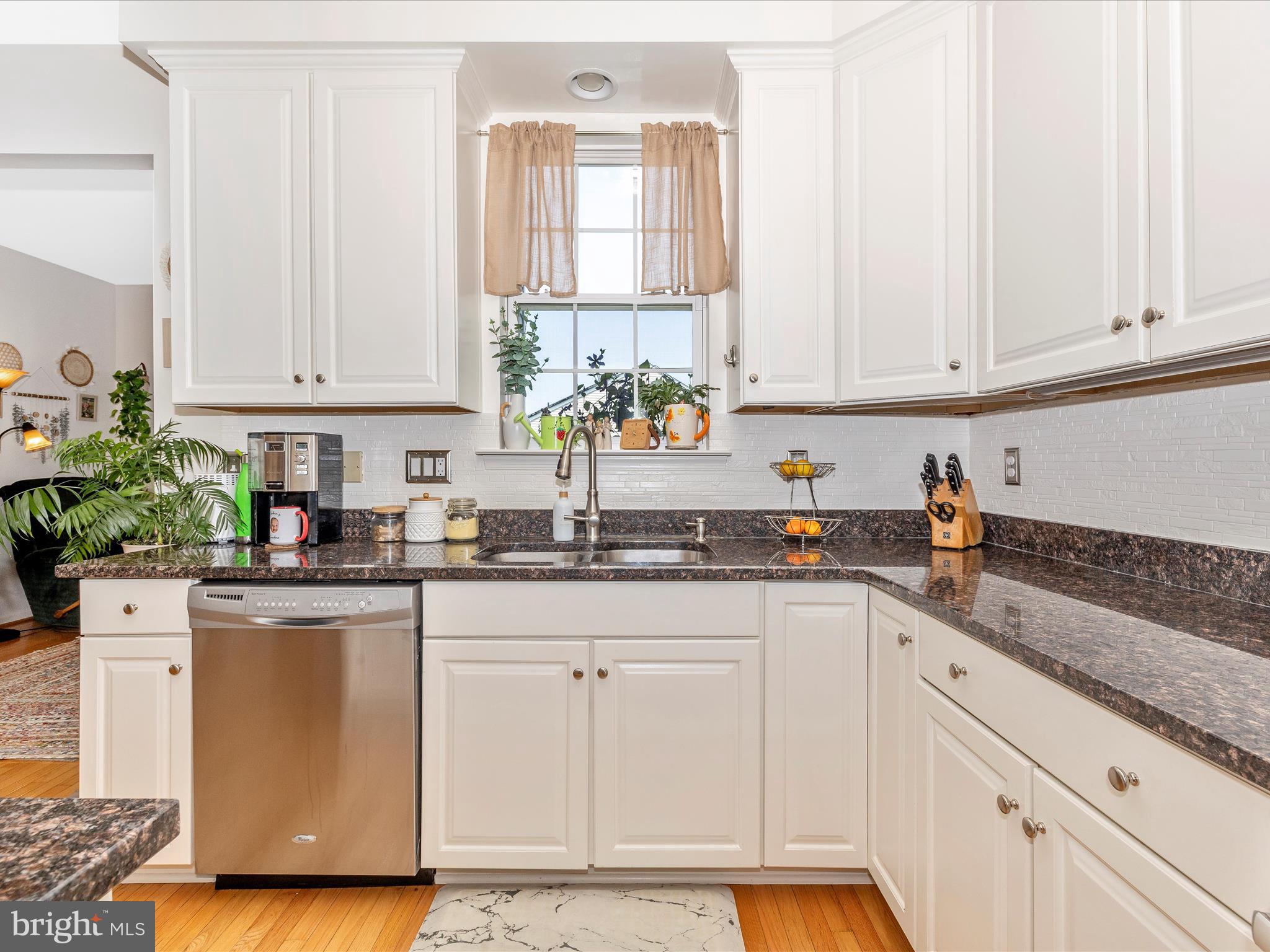 12954 Yellow Jacket Road Hagerstown, MD 21740 - Photo 19 of 54 a kitchen with granite countertop white cabinets and white appliances