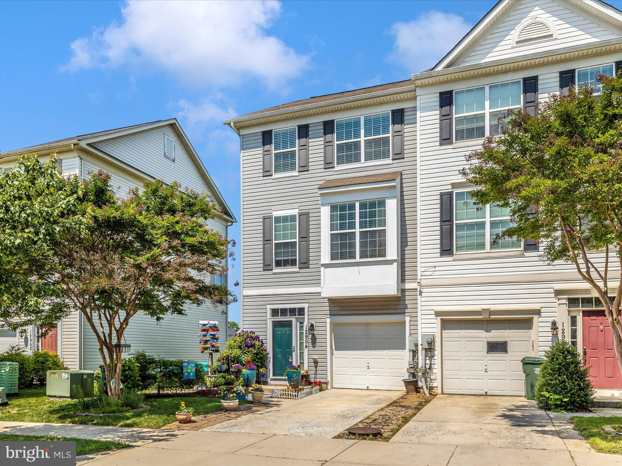 12954 Yellow Jacket Road Hagerstown, MD 21740 - Photo 2 of 54 a front view of a house with a yard and garage