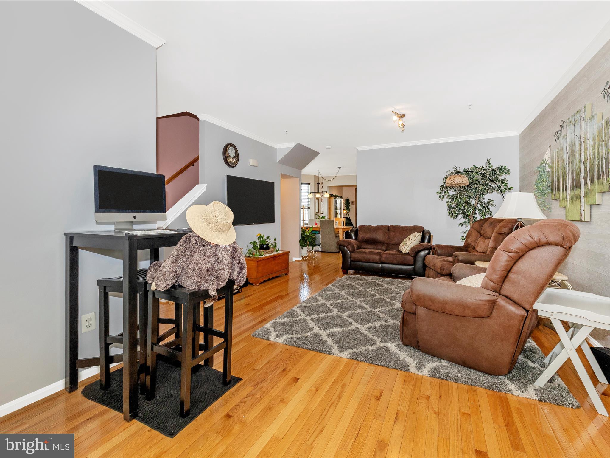12954 Yellow Jacket Road Hagerstown, MD 21740 - Photo 27 of 54 a living room with furniture and wooden floor