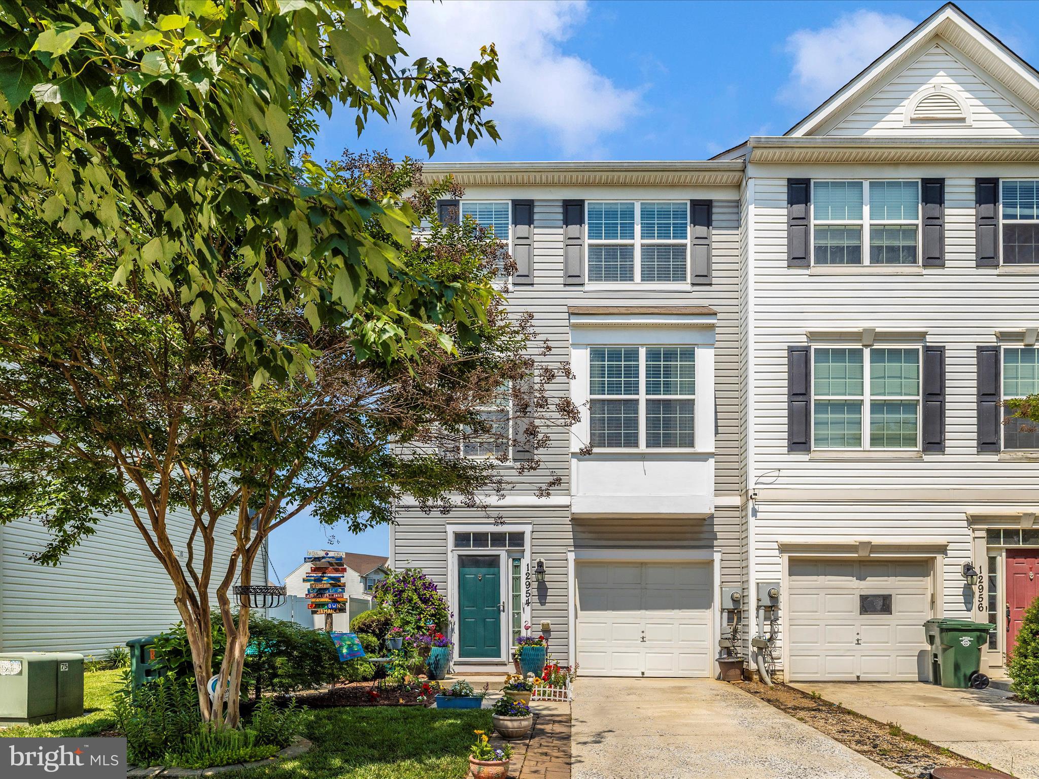 12954 Yellow Jacket Road Hagerstown, MD 21740 - Photo 3 of 54 a front view of a house with a yard and garage