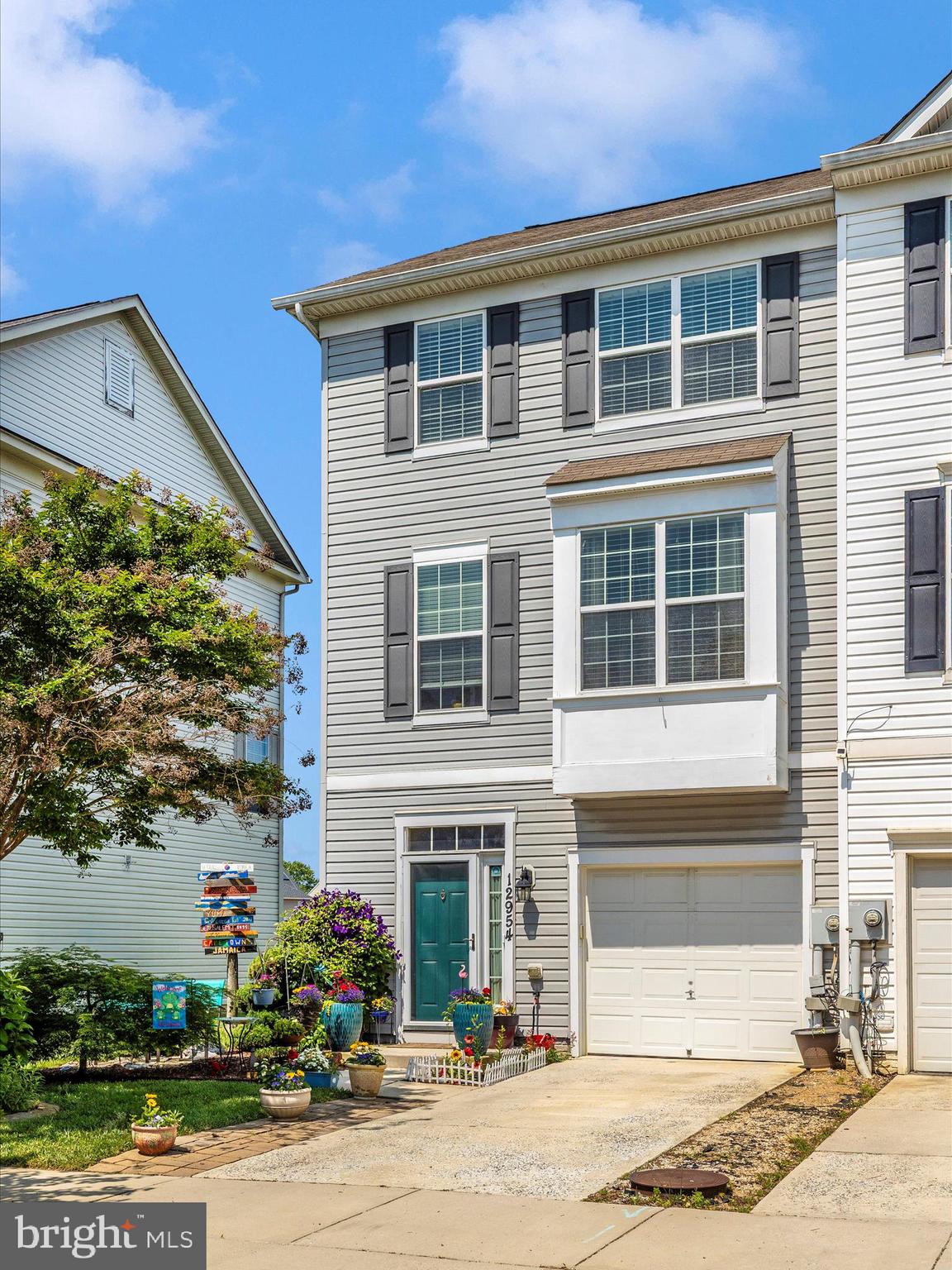 12954 Yellow Jacket Road Hagerstown, MD 21740 - Photo 5 of 54 a front view of a house with a yard and garage