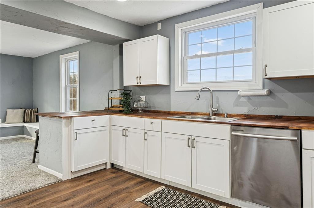148 Sycamore Street Irwin, PA 15642 - Photo 12 of 45 a kitchen with granite countertop white cabinets and white appliances