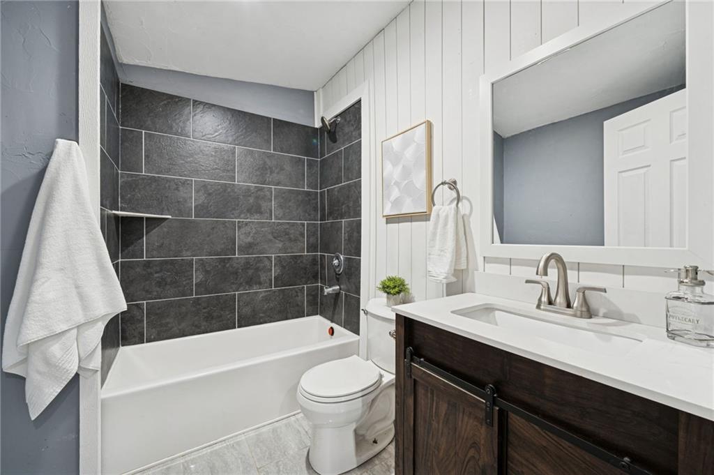 148 Sycamore Street Irwin, PA 15642 - Photo 16 of 45 a bathroom with a sink a toilet and bathtub