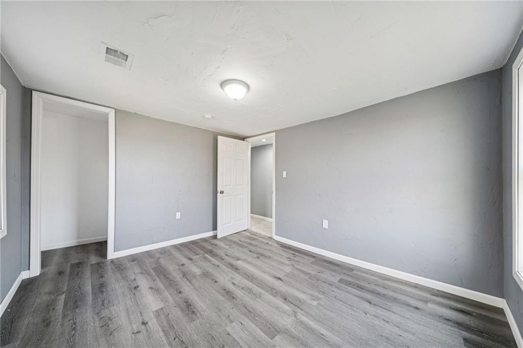 148 Sycamore Street Irwin, PA 15642 - Photo 18 of 45 a view of an empty room with wooden floor