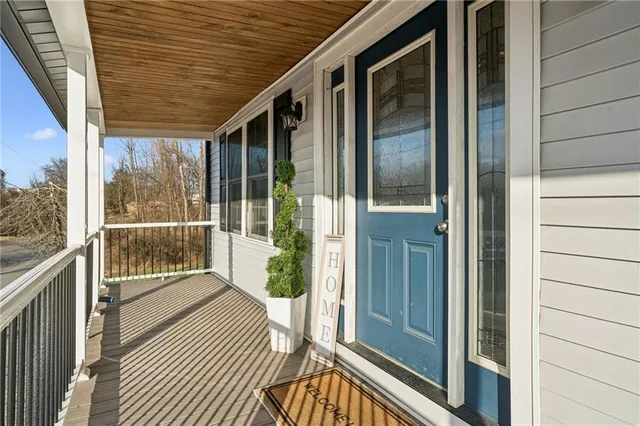 a view of a balcony with wooden floor