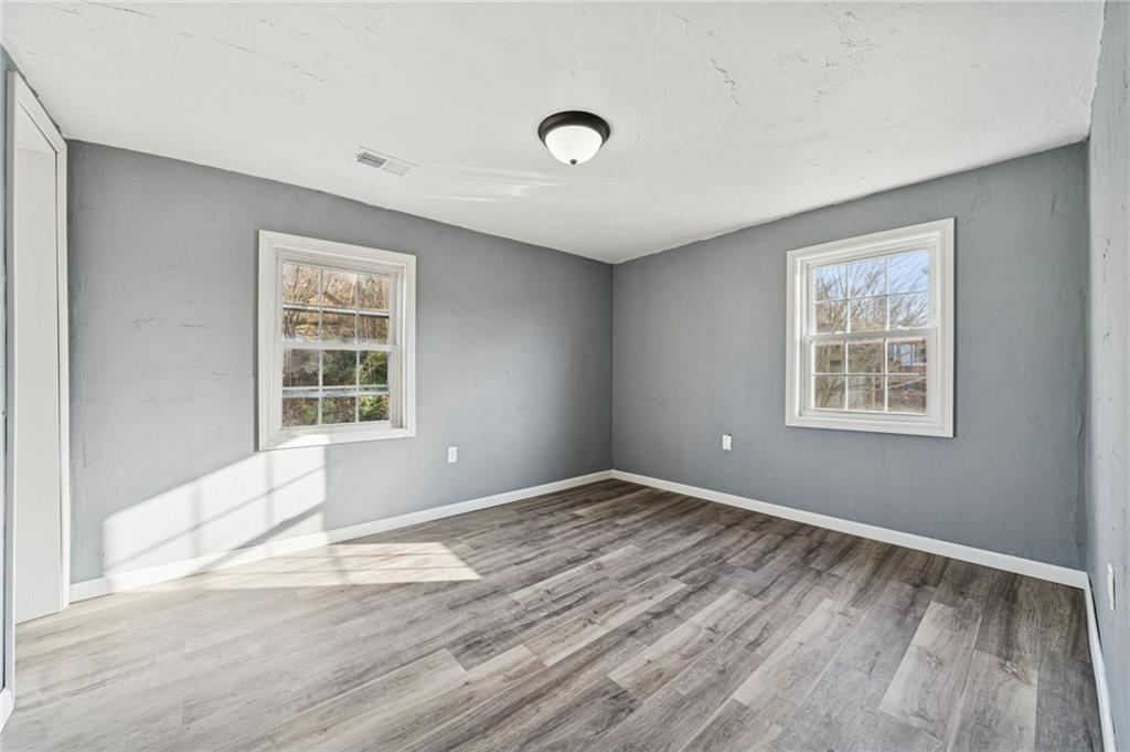 148 Sycamore Street Irwin, PA 15642 - Photo 25 of 45 a view of empty room with wooden floor and fan