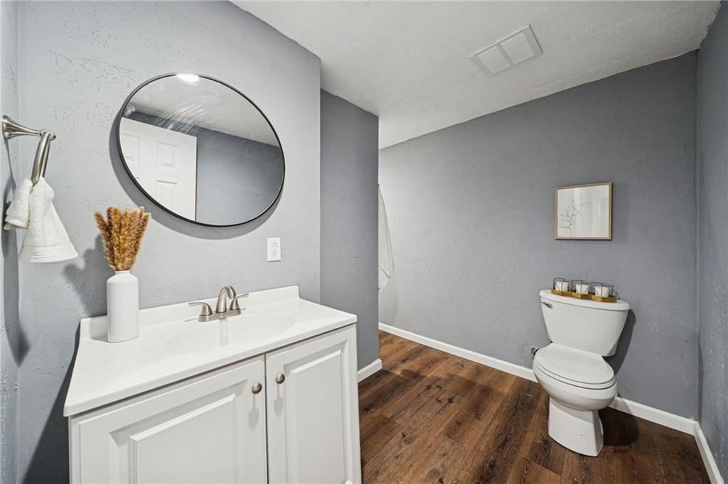 148 Sycamore Street Irwin, PA 15642 - Photo 26 of 45 a bathroom with a toilet sink and mirror