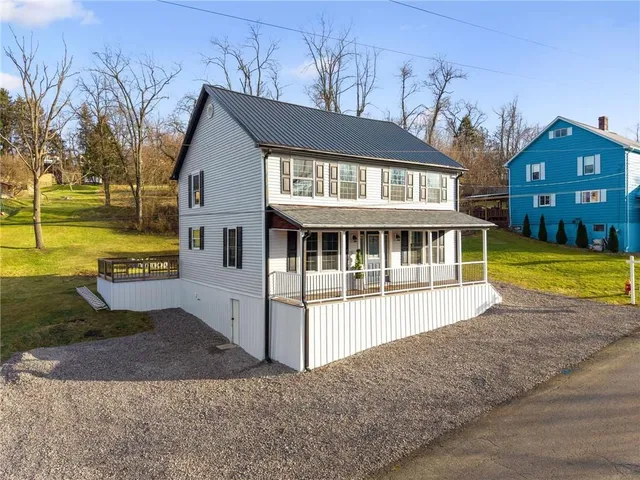 an aerial view of residential building with parking