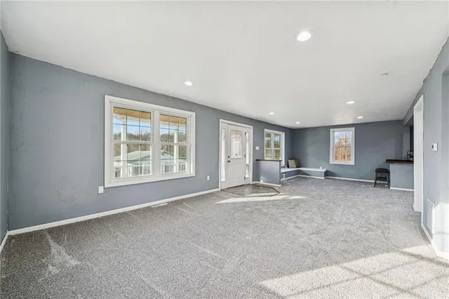 a big room with windows and closet