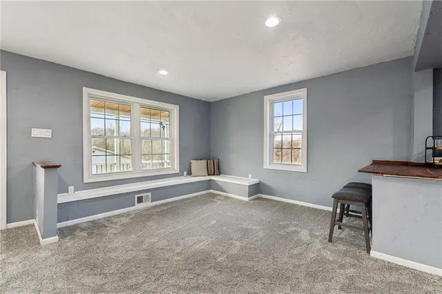 a view of an empty room with a window