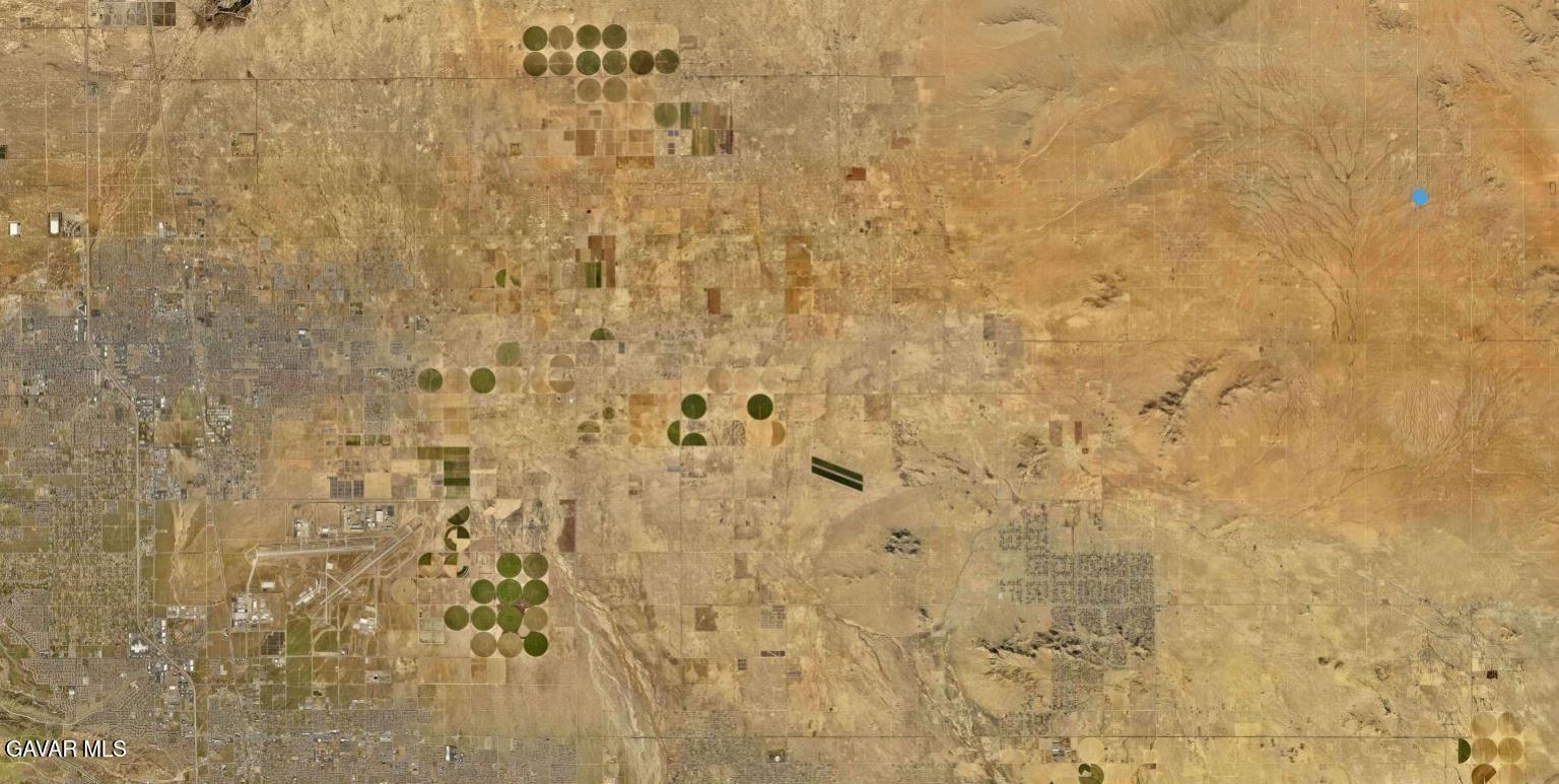 230th Street East Lancaster, CA 93535 - Photo 9 of 12 a bathroom with a shower curtain