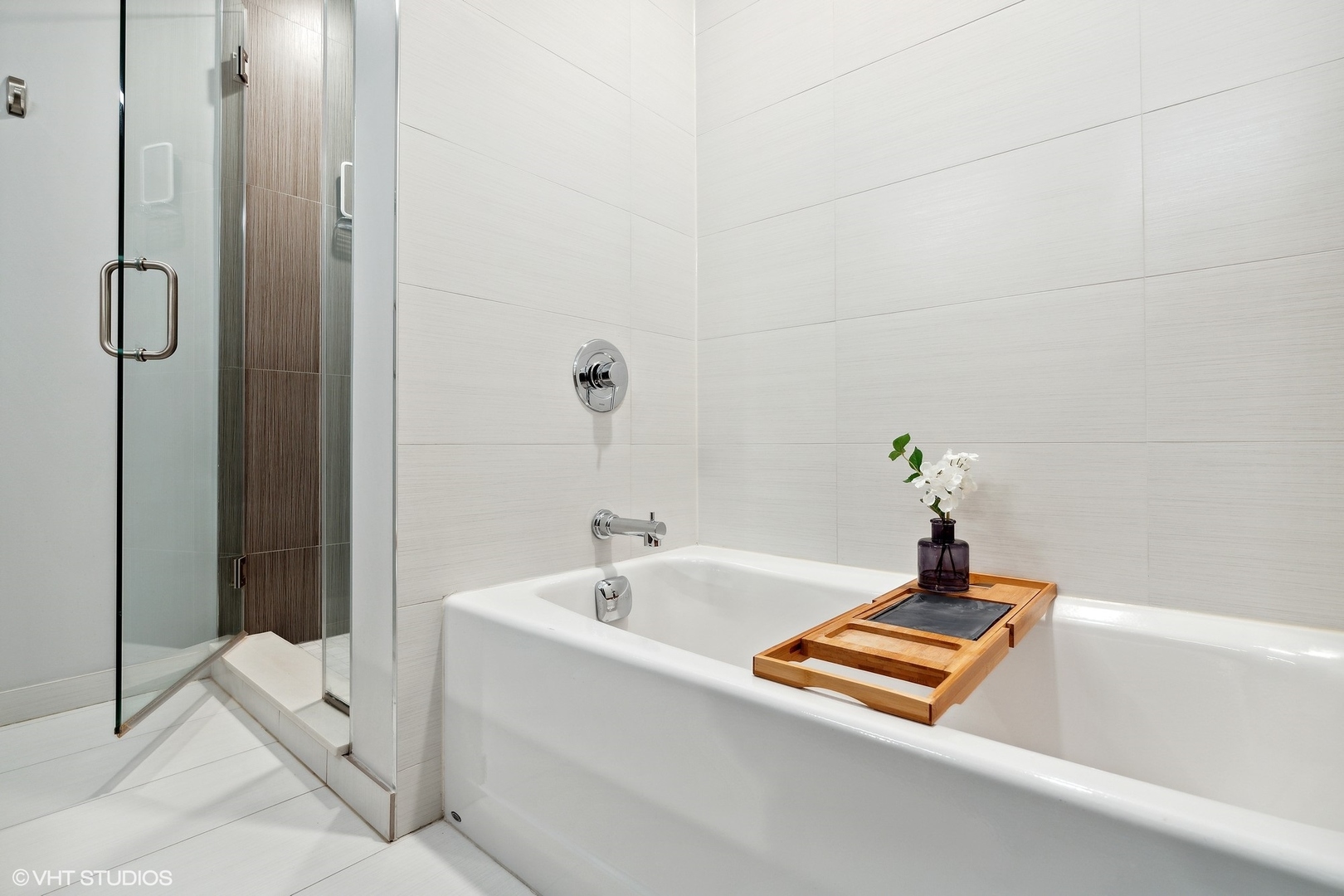 1044 West Polk Street, Unit 1 Chicago, IL 60607 - Photo 13 of 22 a bathroom with a tub and shower