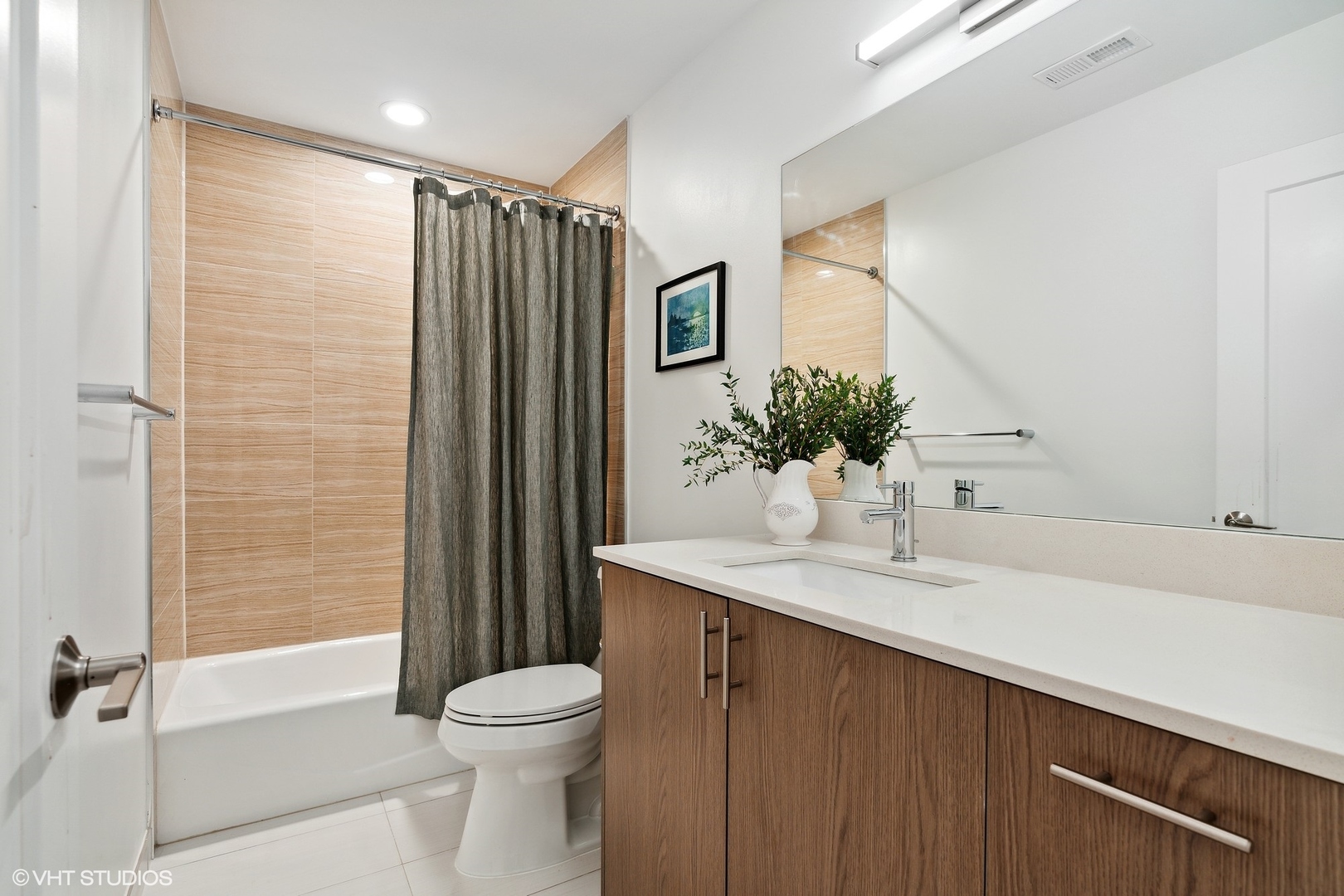 1044 West Polk Street, Unit 1 Chicago, IL 60607 - Photo 15 of 22 a bathroom with a granite countertop sink toilet and shower