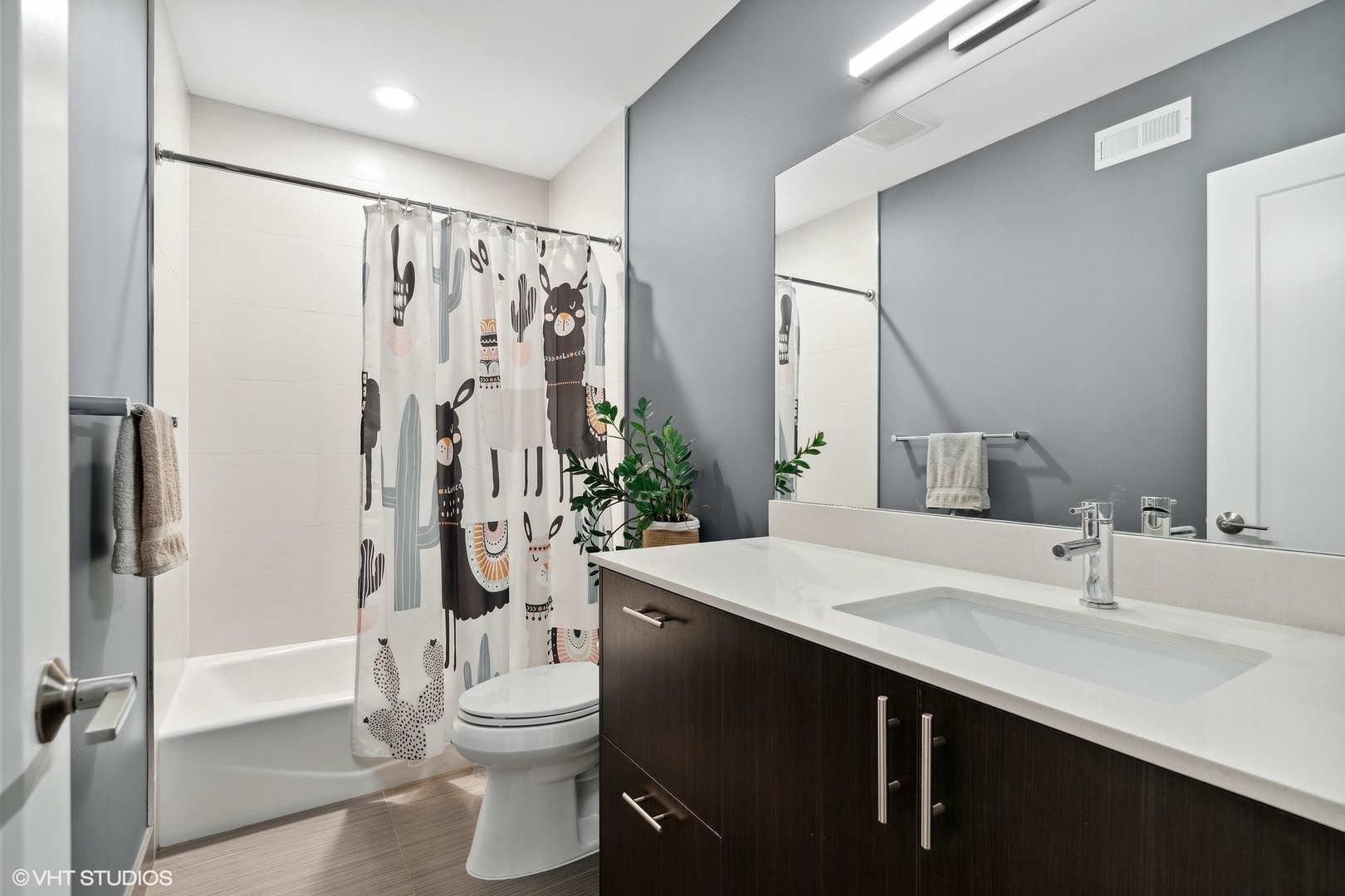 1044 West Polk Street, Unit 1 Chicago, IL 60607 - Photo 17 of 22 a bathroom with a sink a toilet and shower