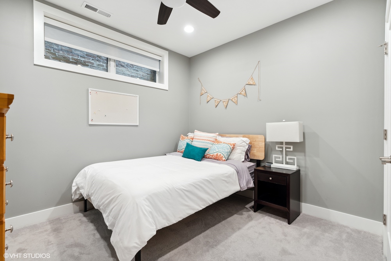 1044 West Polk Street, Unit 1 Chicago, IL 60607 - Photo 19 of 22 a bedroom with a bed and a ceiling fan
