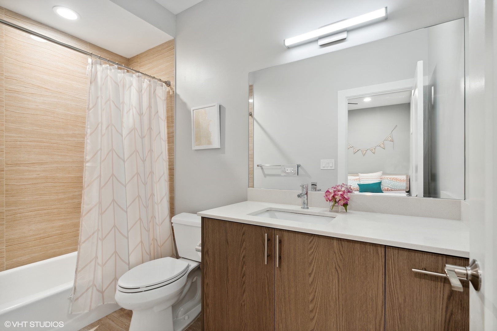 1044 West Polk Street, Unit 1 Chicago, IL 60607 - Photo 20 of 22 a bathroom with a sink a toilet and shower