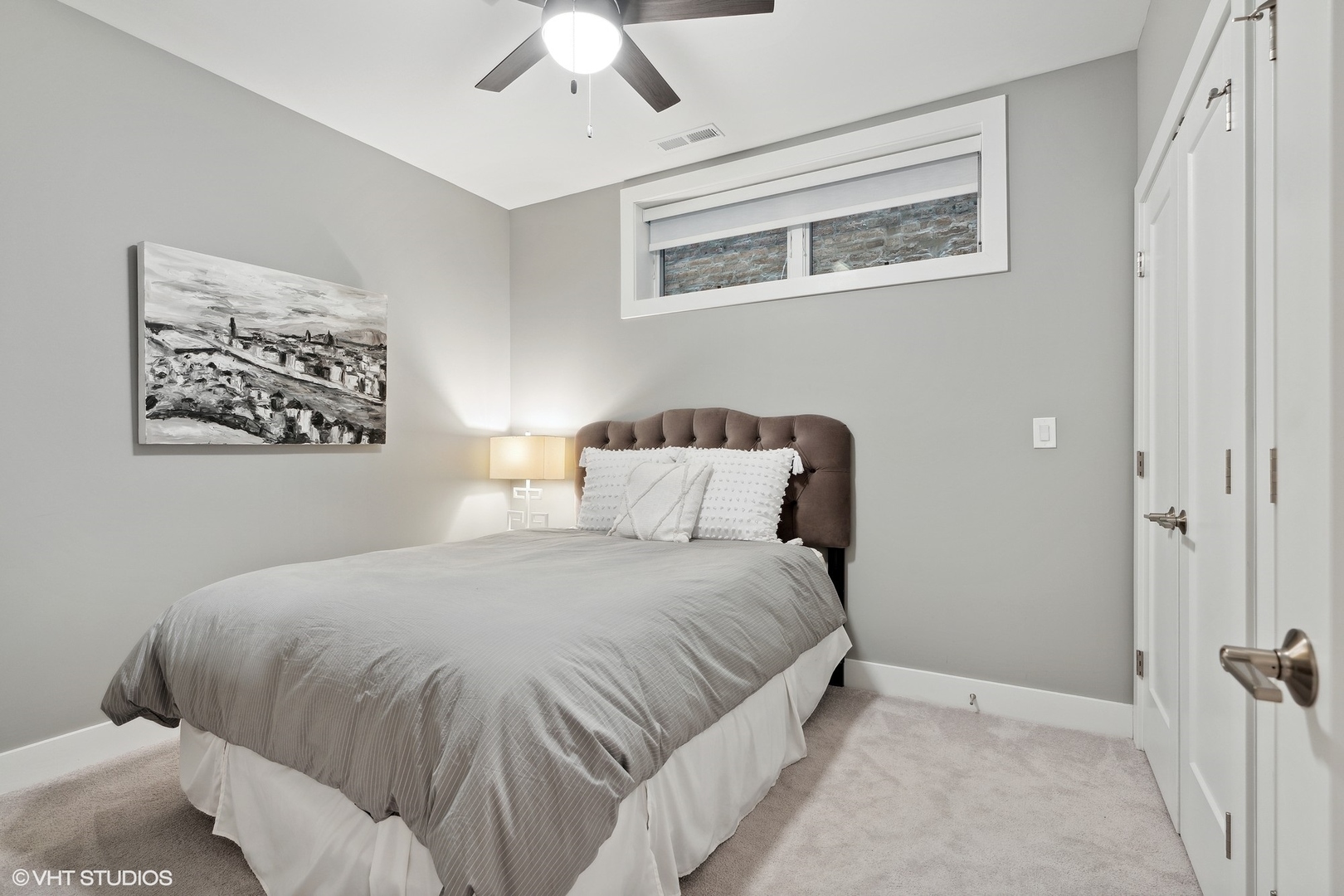 1044 West Polk Street, Unit 1 Chicago, IL 60607 - Photo 21 of 22 a bedroom with a bed and a window