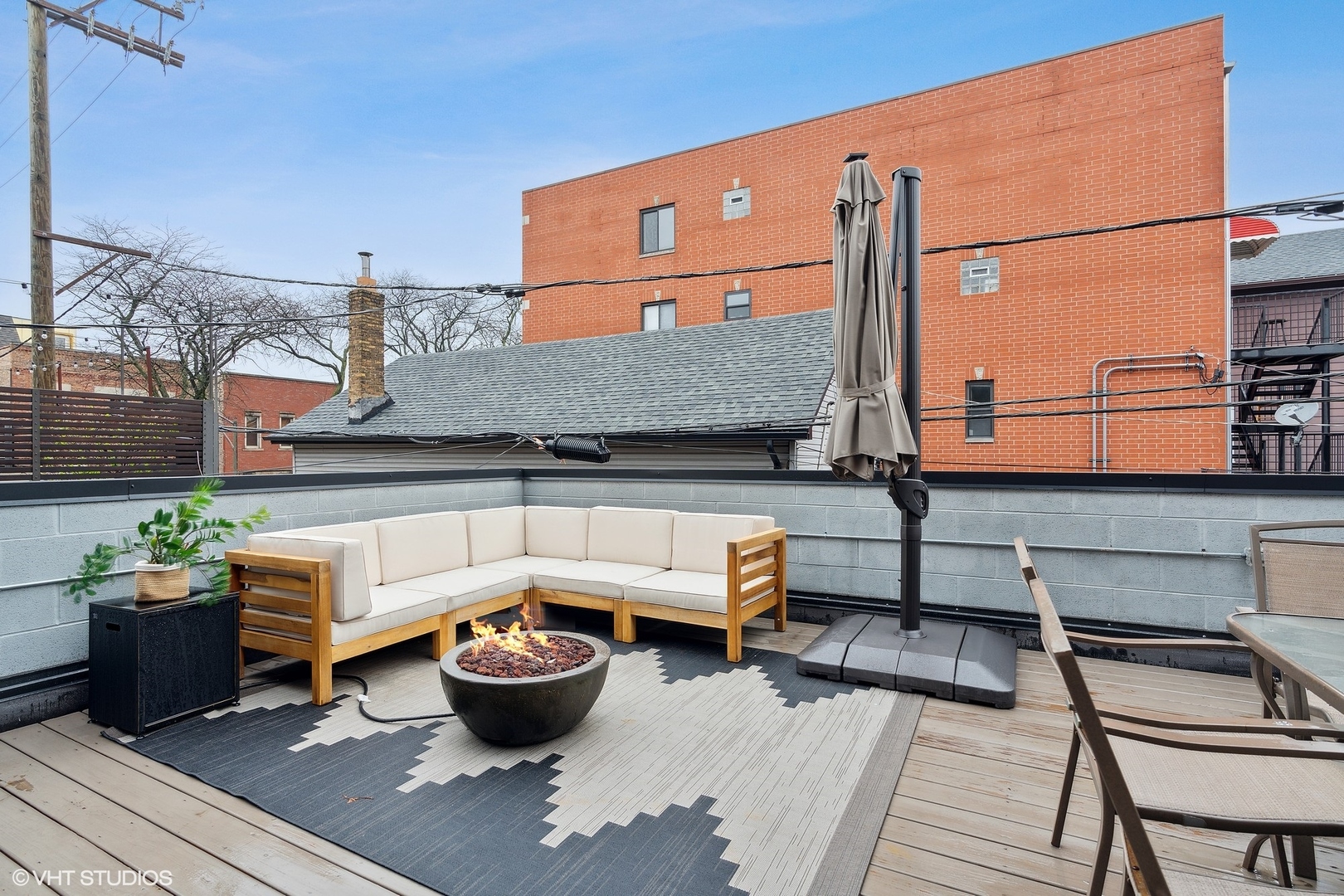 1044 West Polk Street, Unit 1 Chicago, IL 60607 - Photo 22 of 22 a view of a patio with couches and potted plants
