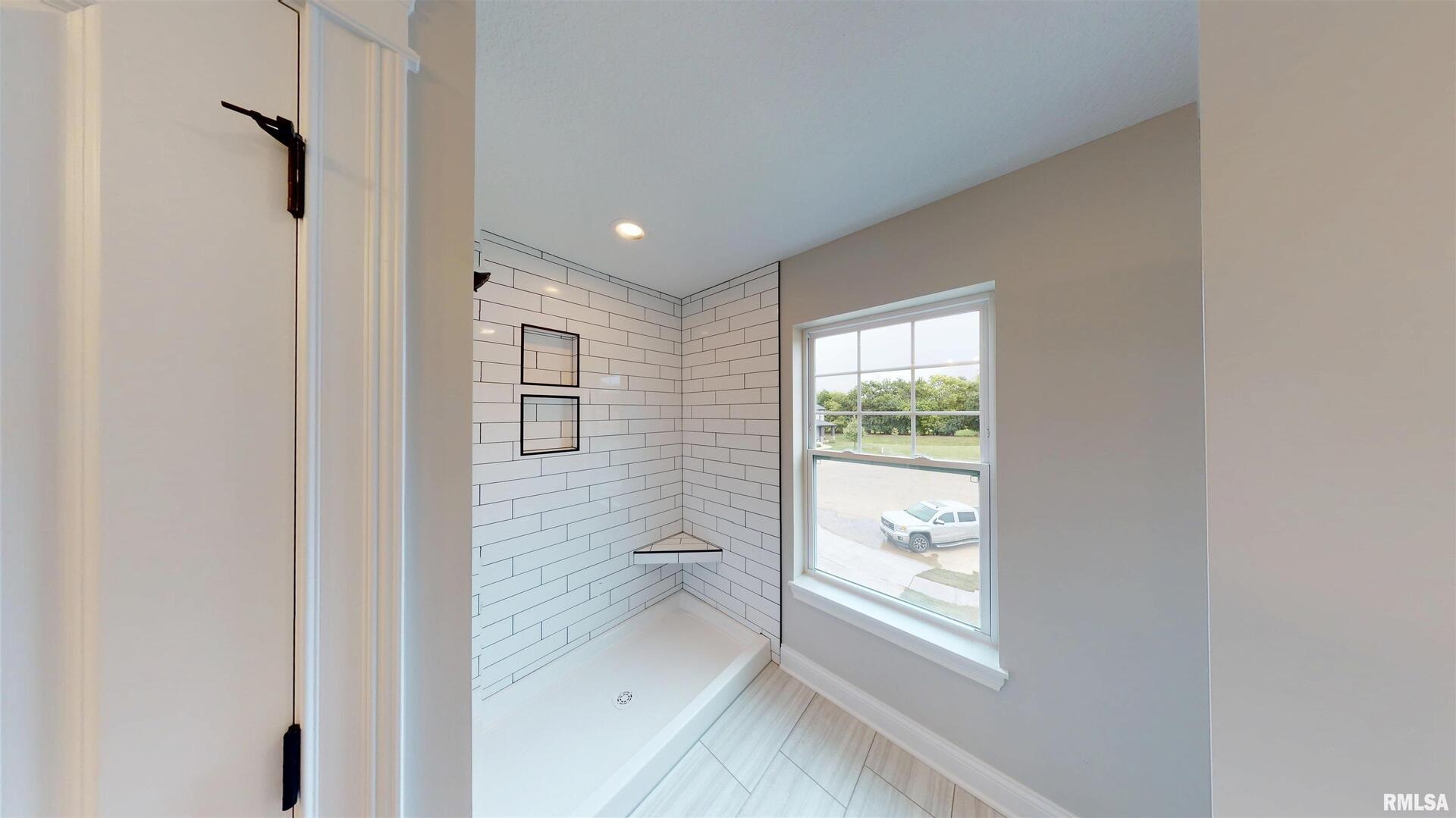 11 Faiths Way Bettendorf, IA 52722 - Photo 20 of 22 a view of an empty room and window