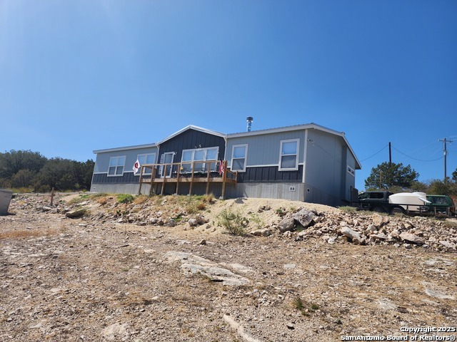 a view of a house with a snow in the yard