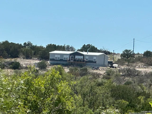 a top view of a house with a yard and sitting area