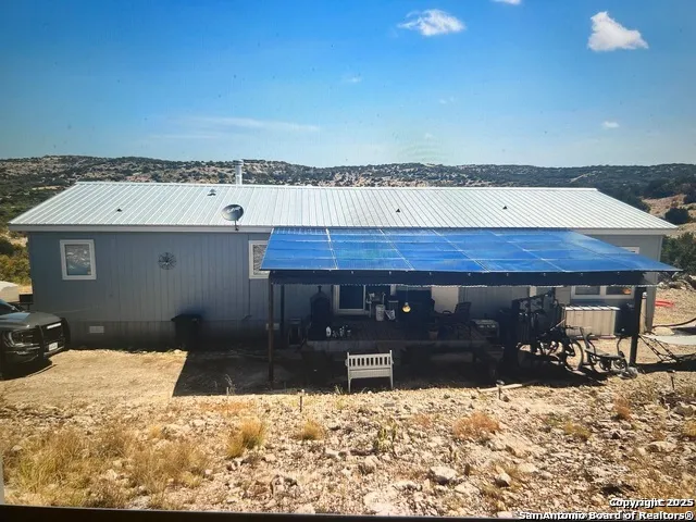 a room with a table and a fireplace