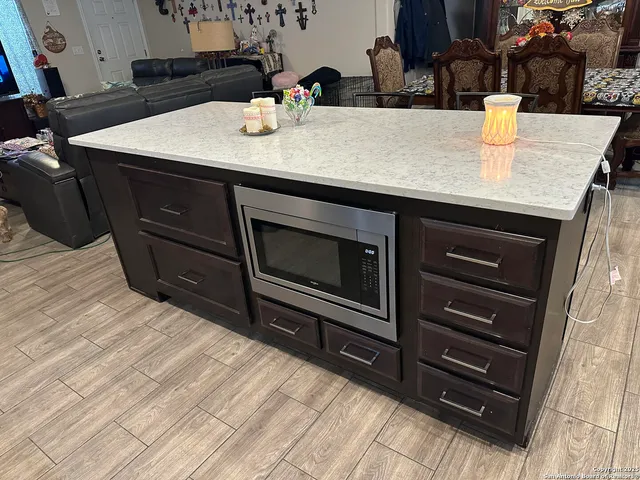 a kitchen with a sink and cabinets