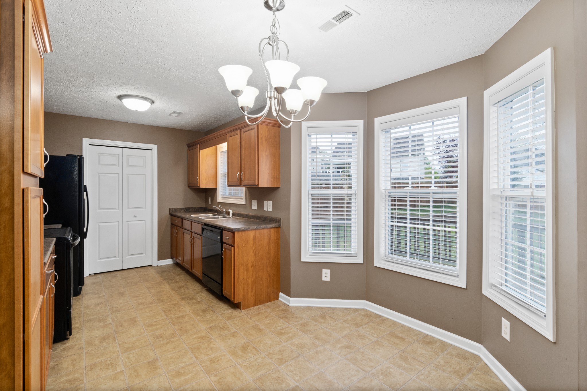 3178 Cross Ridge Drive Clarksville, TN 37040 - Photo 12 of 25 a kitchen that has a lot of furniture and a window