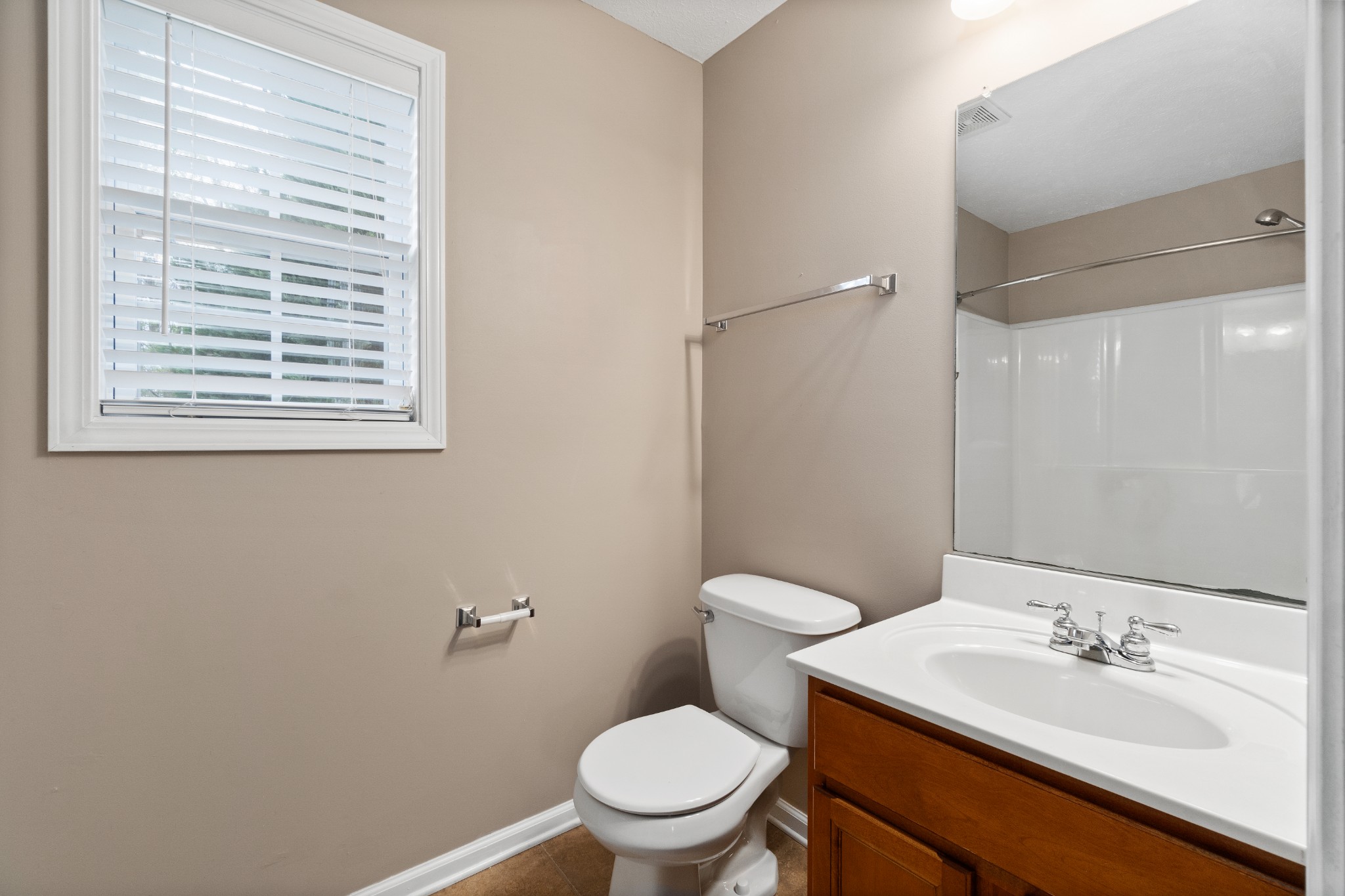 3178 Cross Ridge Drive Clarksville, TN 37040 - Photo 15 of 25 a bathroom with a sink a toilet and a mirror