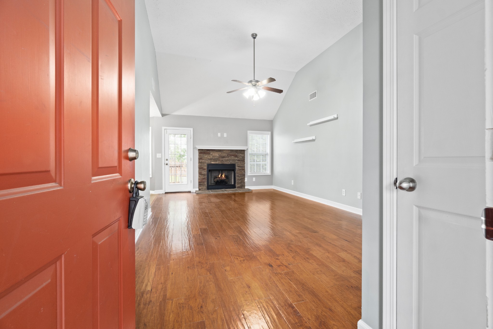 3178 Cross Ridge Drive Clarksville, TN 37040 - Photo 3 of 25 wooden floor fireplace and natural light in living room