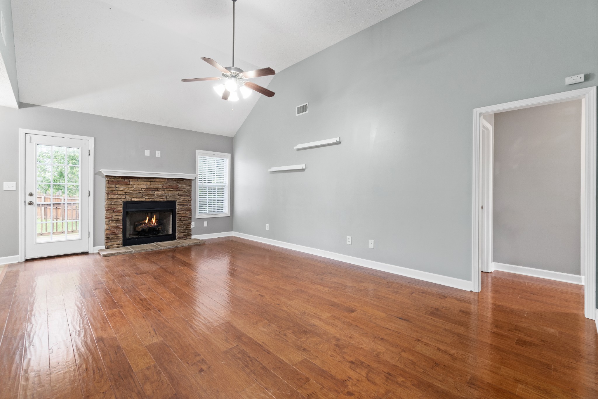 3178 Cross Ridge Drive Clarksville, TN 37040 - Photo 4 of 25 a view of an empty room with wooden floor fireplace and a window