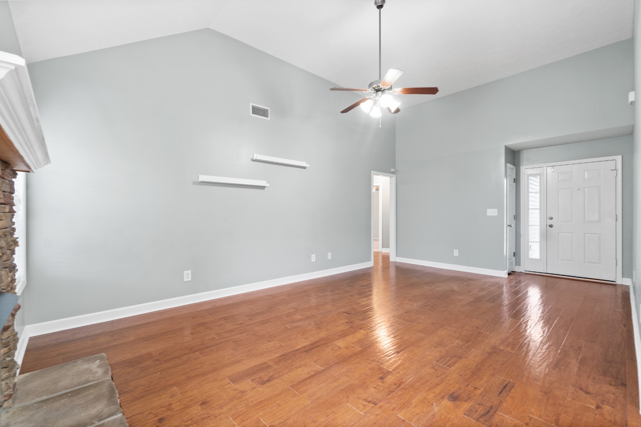 3178 Cross Ridge Drive Clarksville, TN 37040 - Photo 7 of 25 a view of an empty room with a ceiling fan and wooden floor