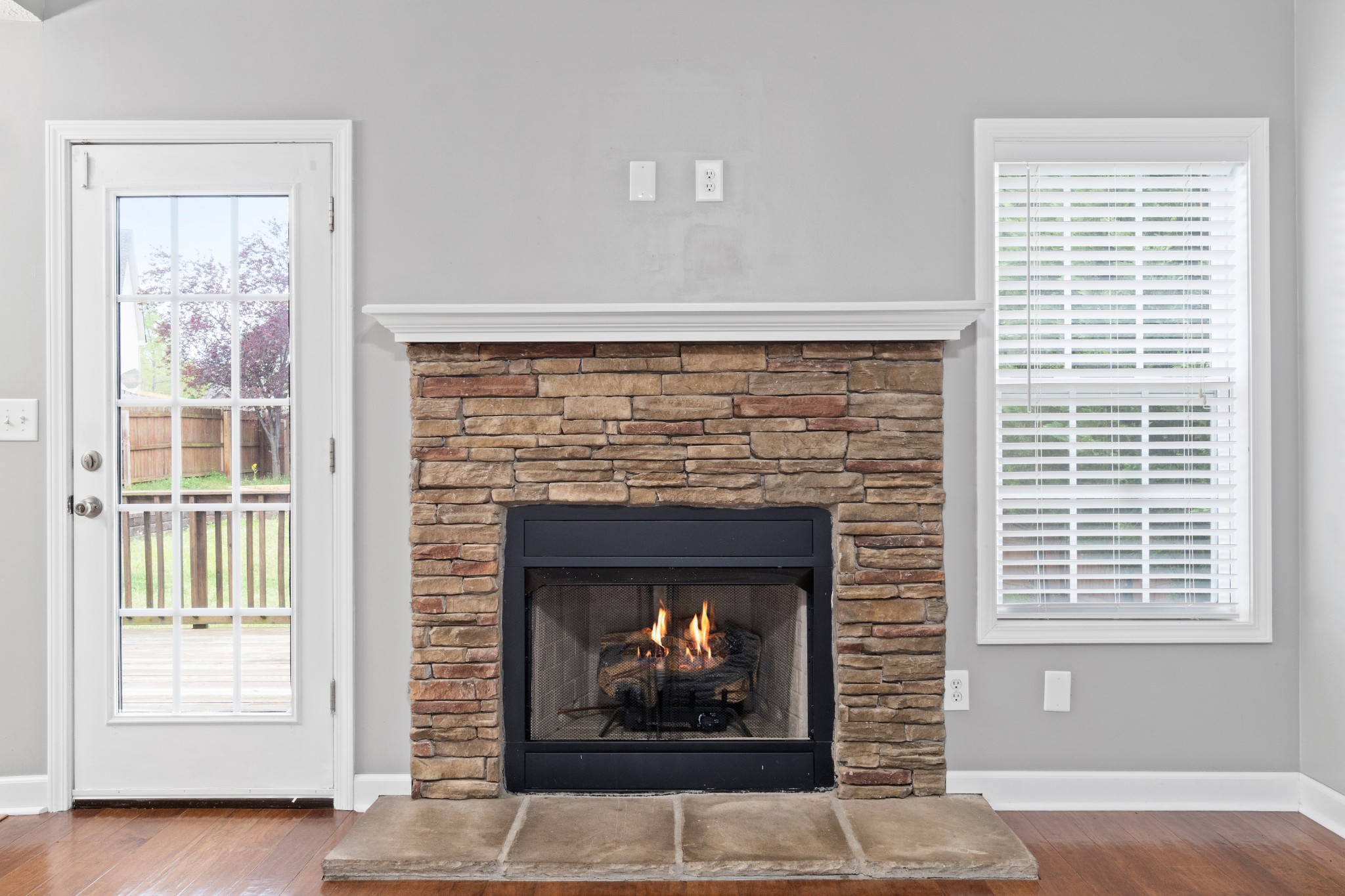 3178 Cross Ridge Drive Clarksville, TN 37040 - Photo 8 of 25 a living room with a fireplace and a window
