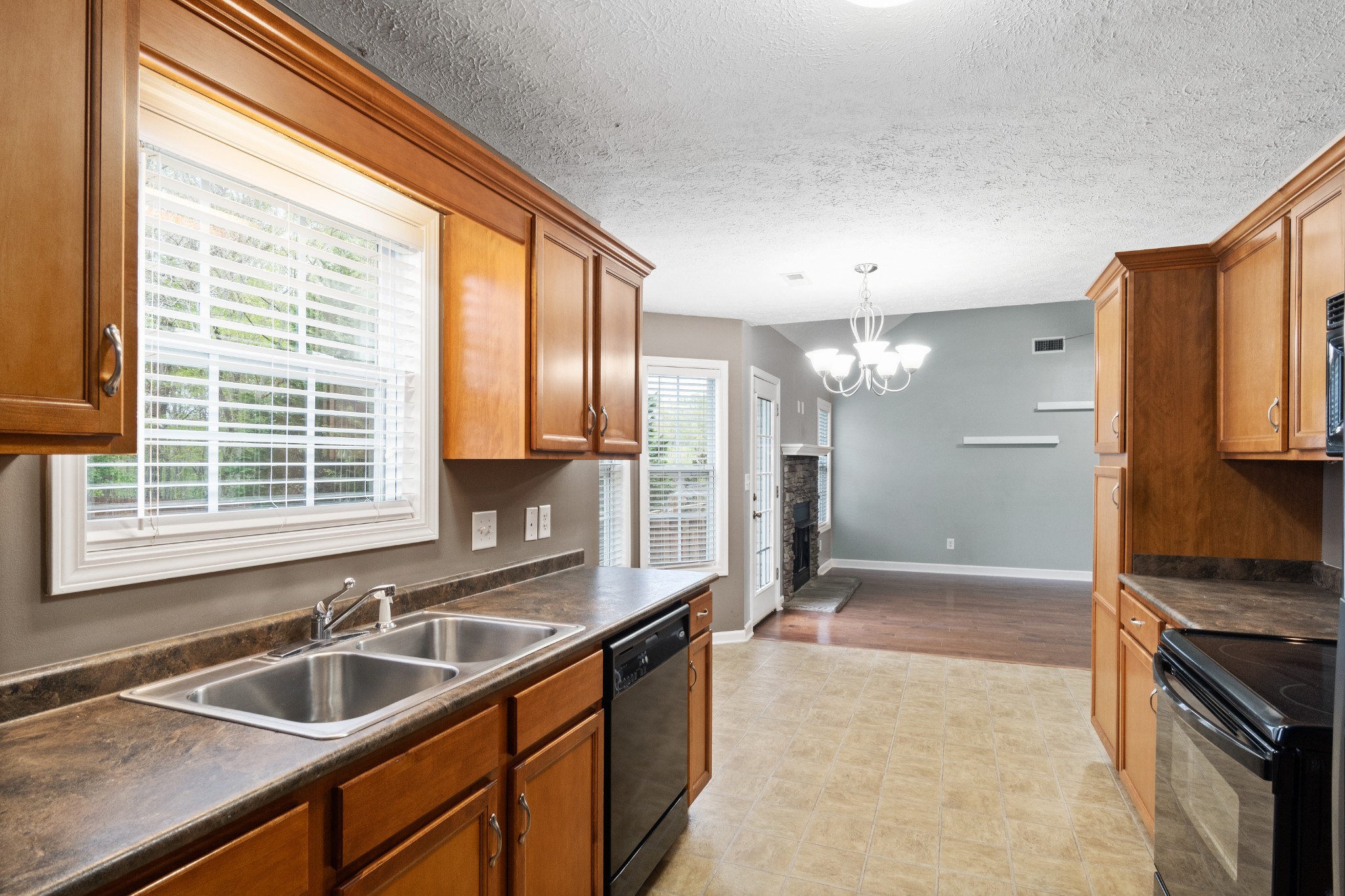 3178 Cross Ridge Drive Clarksville, TN 37040 - Photo 10 of 25 a kitchen with granite countertop a sink and a refrigerator